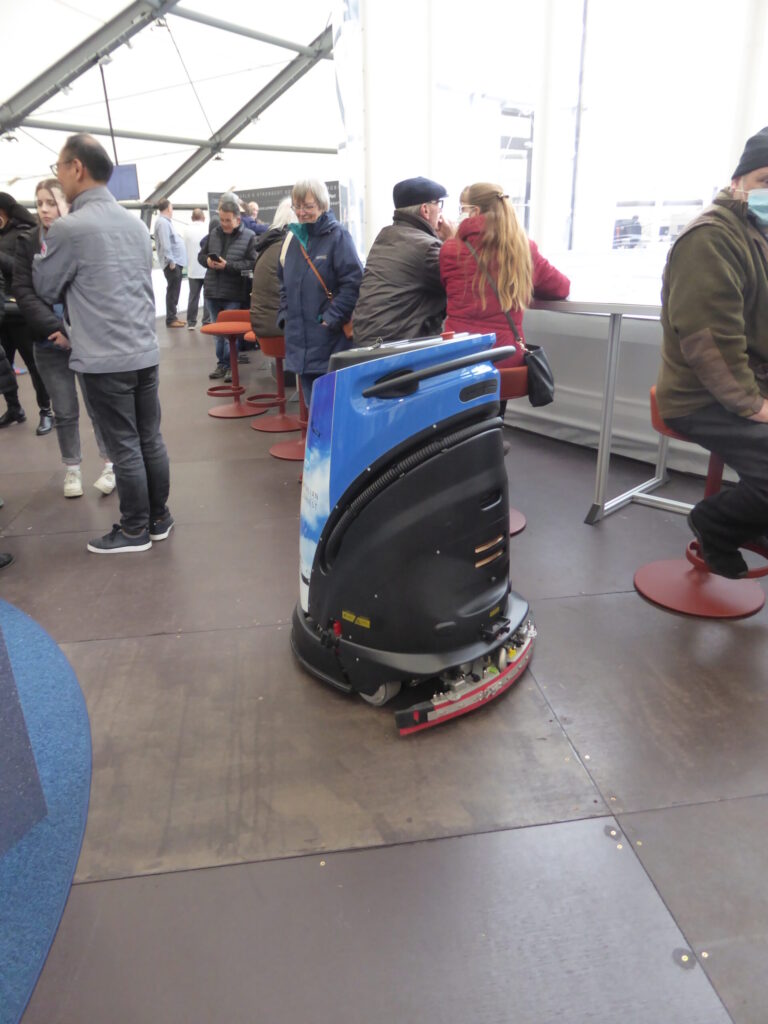 A robot vacuum cleaner cleans the airport!