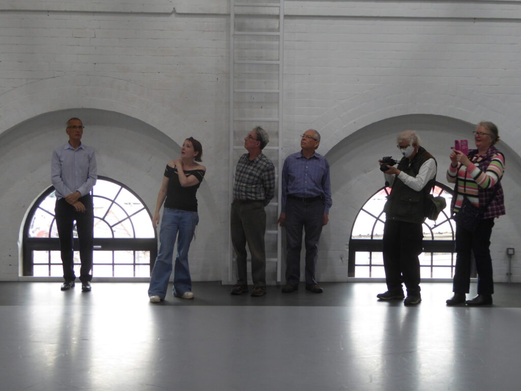 CovSoc members touring the building