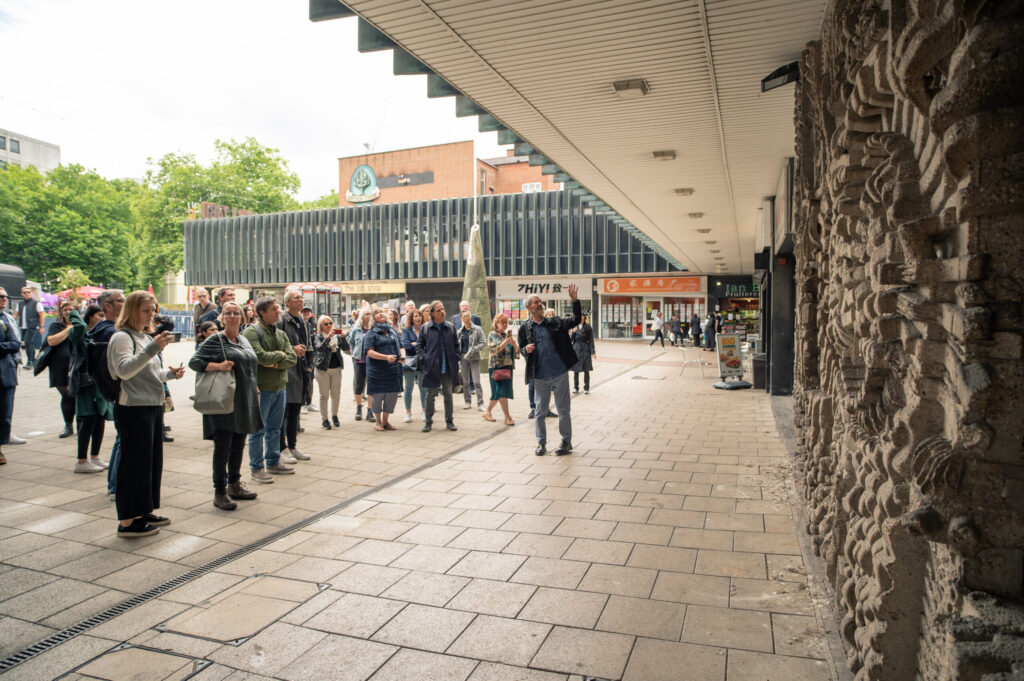 Mark explains the listed Michell sculpture in Bull Yard