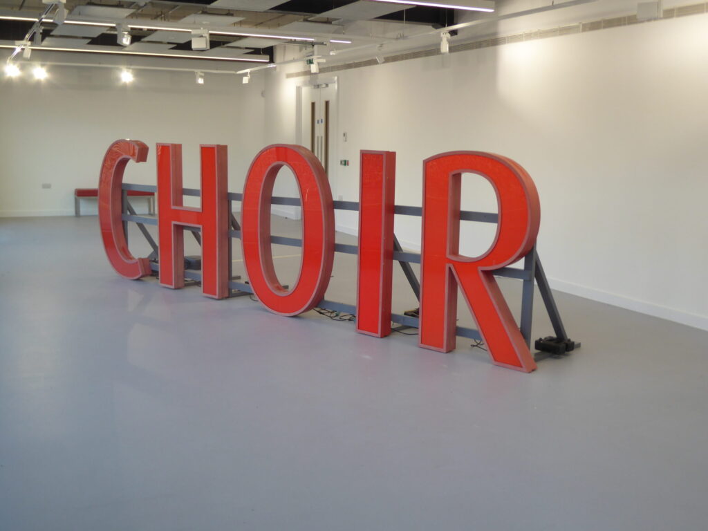 Choir - illuminated sign from the Ricoh Arena