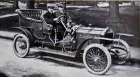 Old photo of Louis Coatalen driving the first Hillman car produced in 1907