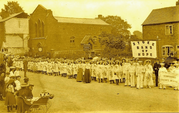 Old postcard showing the chapel in Stoke with Stoke band of Hope members standing in front.