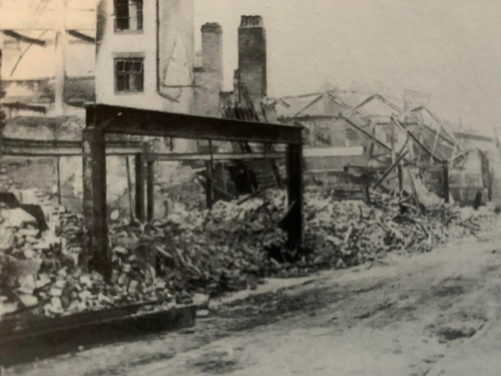 Image showin the remains of Charles Ager shop in Smithford Street after the blitz.